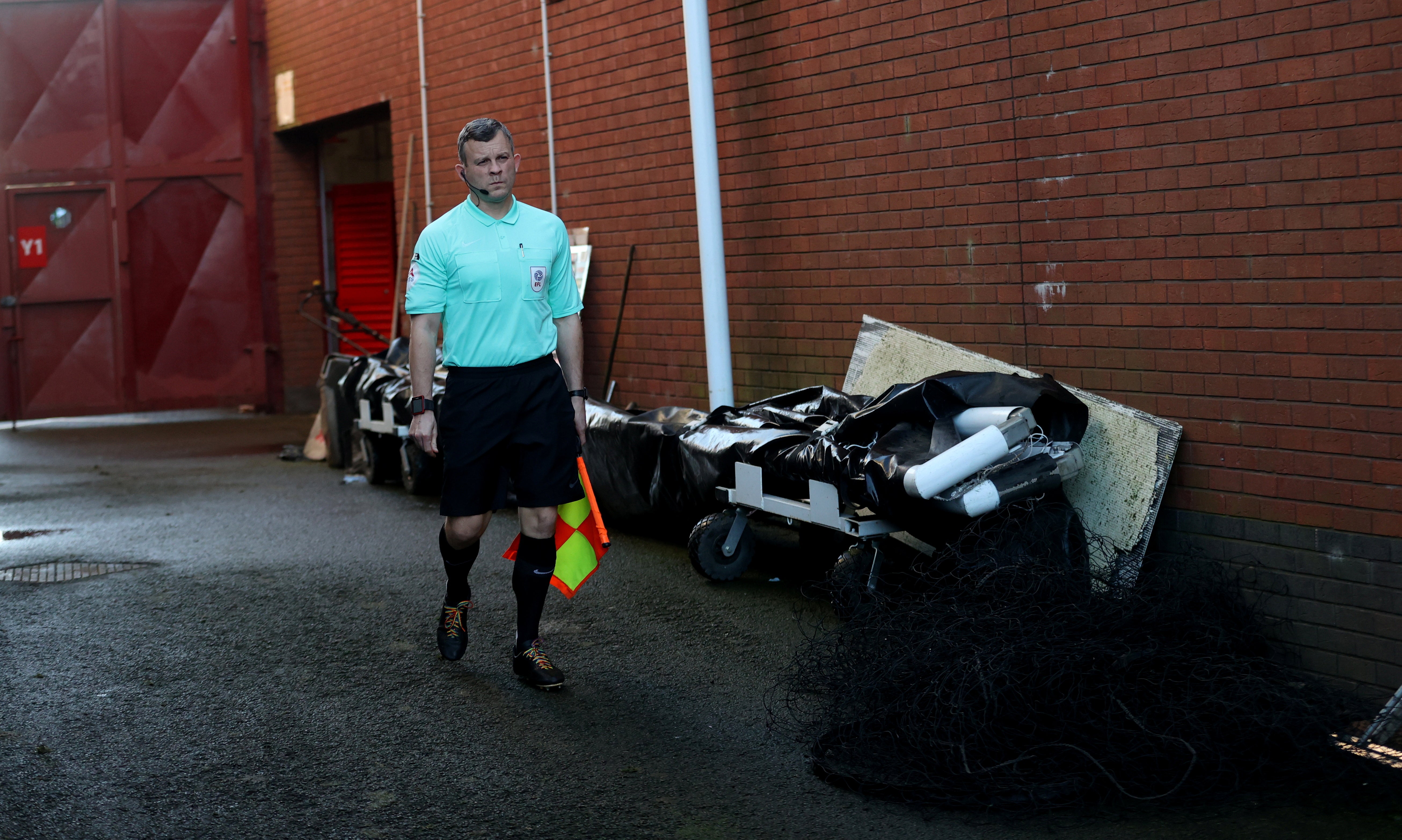 An assistant referee wears rainbow laces as he makes his way to the pitch via the emergency gate, instead of the tunnel before the Championship match between Stoke and Middlesbrough in December. The tunnel is for the home team only, everyone else gets changed in different areas of the stadium. He’s waiting for the away team who get changed in a temporary building in the car park