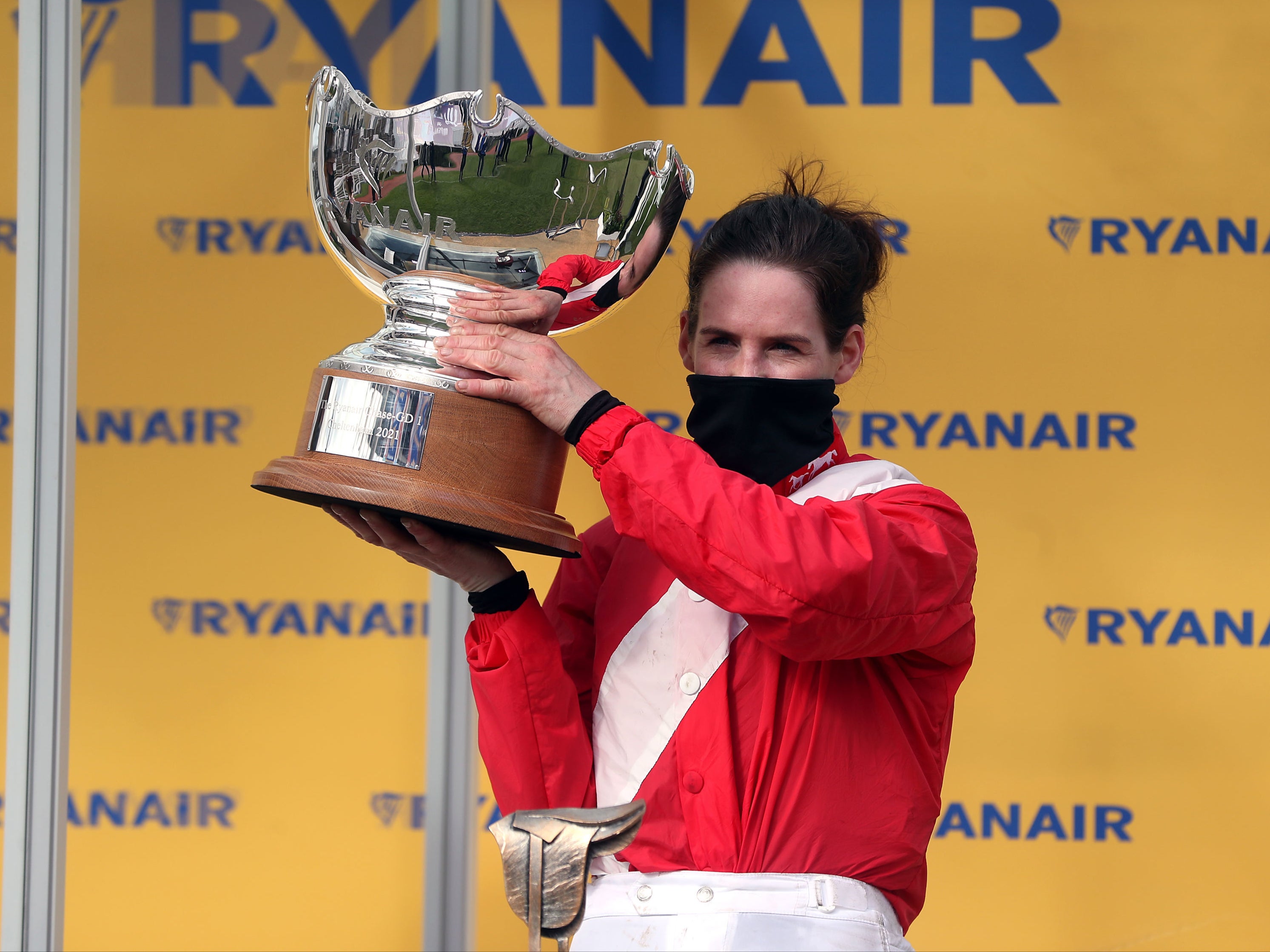 Rachael Blackmore celebrates with the trophy after winning the Ryanair Chase