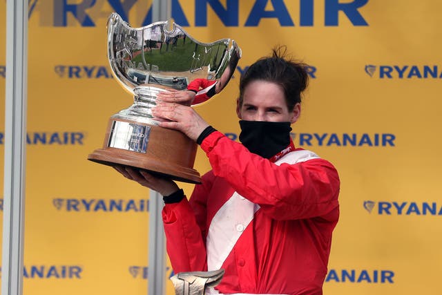 Rachael Blackmore celebrates with the trophy after winning the Ryanair Chase