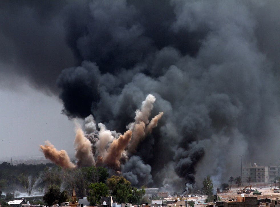 <p>Smoke rises in the sky after a Nato airstrike in Tripoli, 7 June 2011</p>