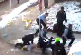 A Minneapolis police officer appears to kneel on a demonstrator’s neck during a violent clash on Thursday morning.