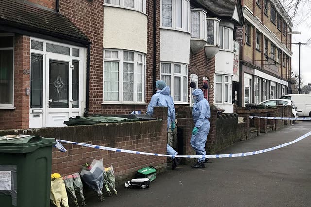 Police at the scene of a stabbing in Lea Bridge Road, Walthamstow, east London, where an 18-year-old man was stabbed to death
