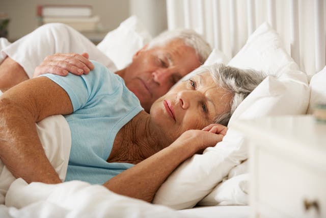 Woman struggling to sleep next to partner