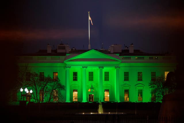 The White House is lit green for St. Patrick’s Day on 17 March 2021 in Washington, DC