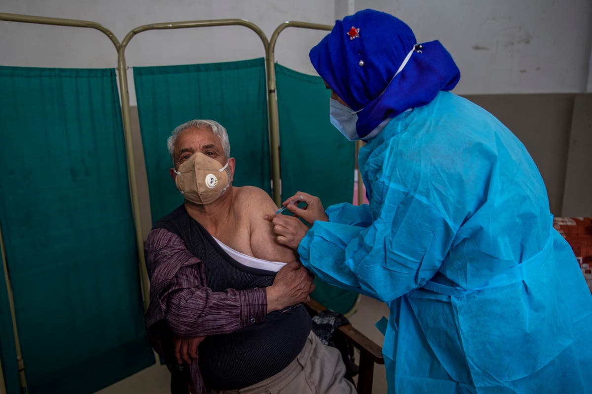 Vaccine delay in Britain stirs equity debate in India