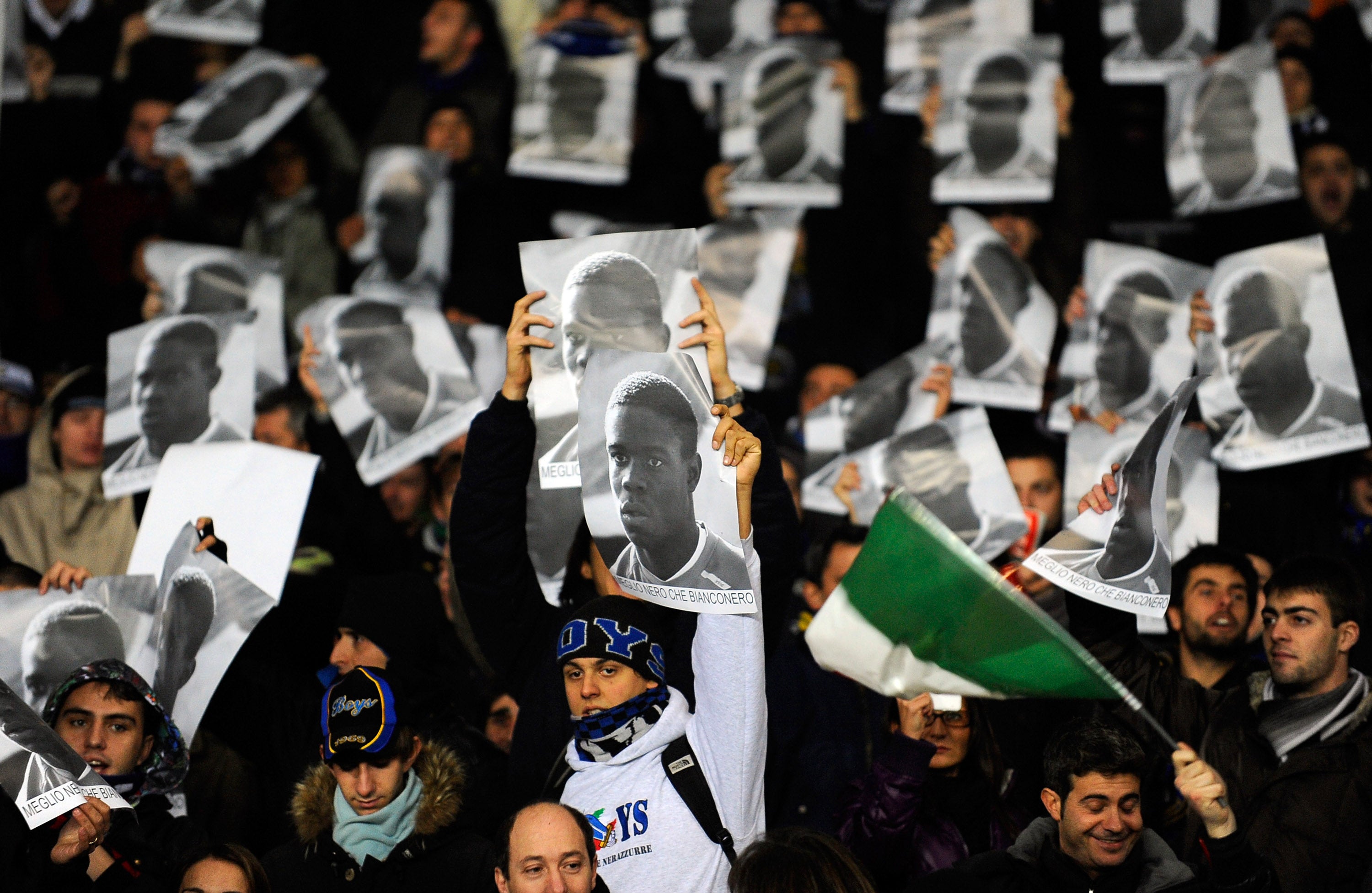 Supporters of FC Internazionale Milano hold up posters of Mario Balotelli in response to racist abuse that the player received in 2009