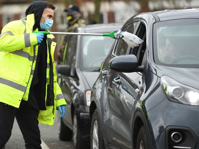 <p>Surge testing in Moston, Greater Manchester, after the detection of a Covid-19 variant of concern</p>