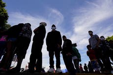 Migrant woman dies as dozens try to swim around US-Mexico border fence