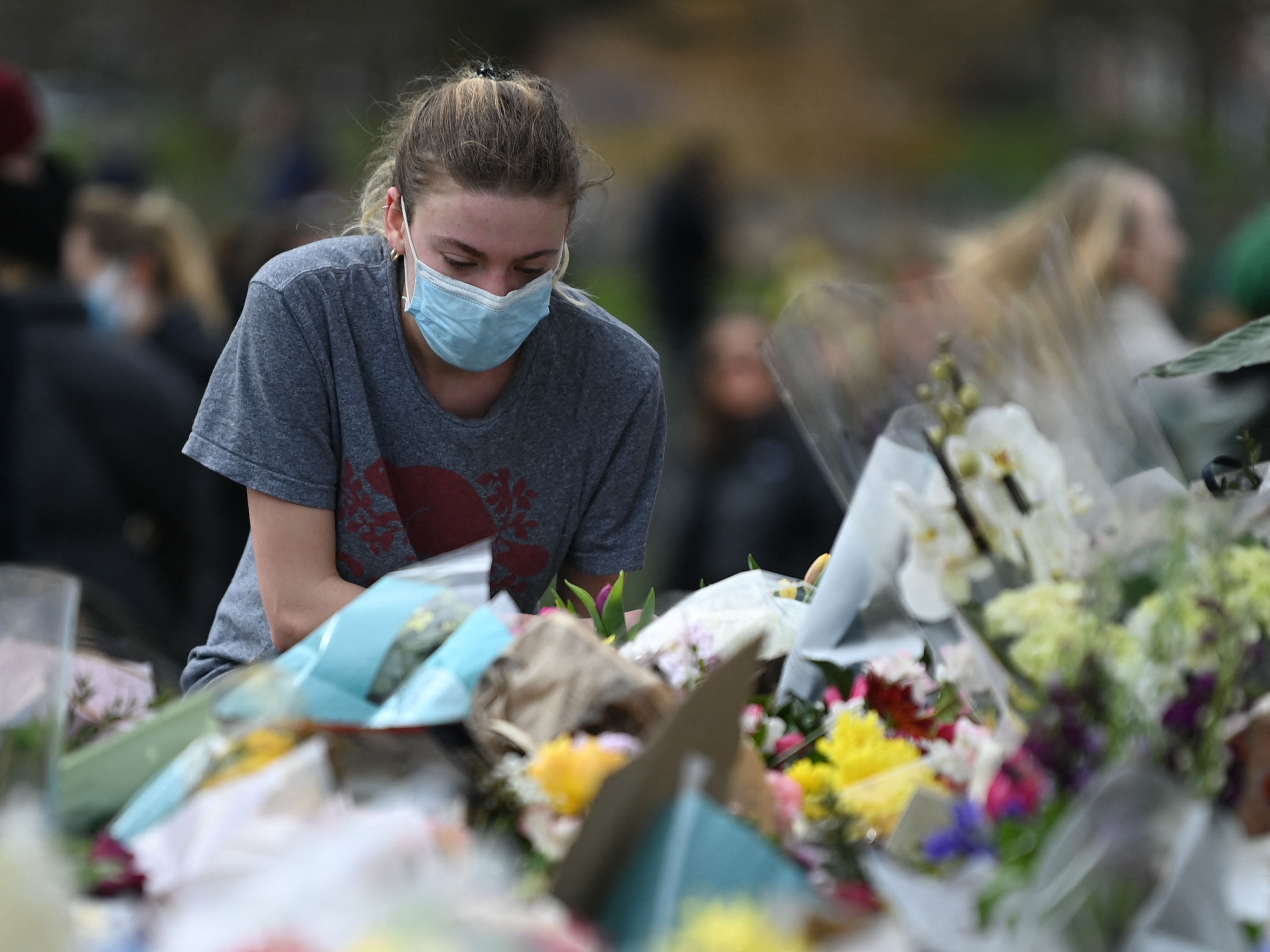 Women laid flowers to honour Sarah Everard, whose death prompted an outpouring of stories from women about harassment and assaults