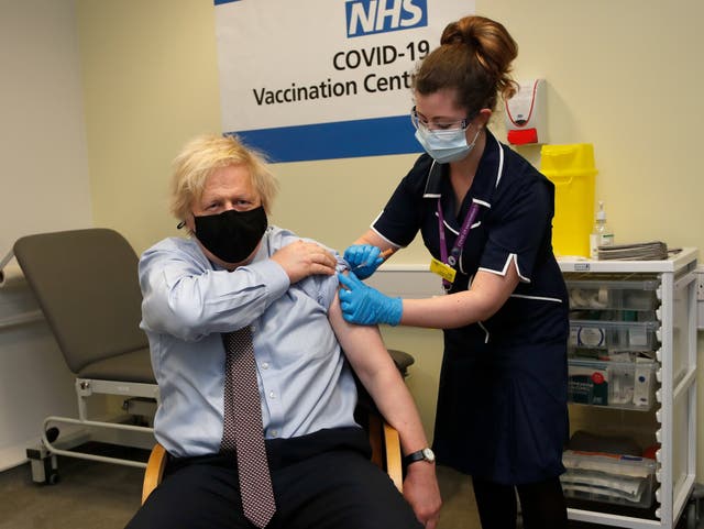 <p>Nurse and clinical pod lead Lily Harrington adninisters the AstraZeneca vaccine to Boris Johnson at St Thomas’ Hospital, London, on Friday</p>