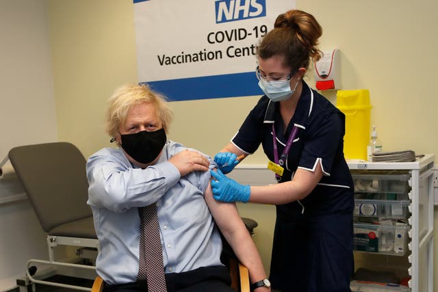 <p>Nurse and clinical pod lead Lily Harrington adninisters the AstraZeneca vaccine to Boris Johnson at St Thomas’ Hospital, London, on Friday</p>