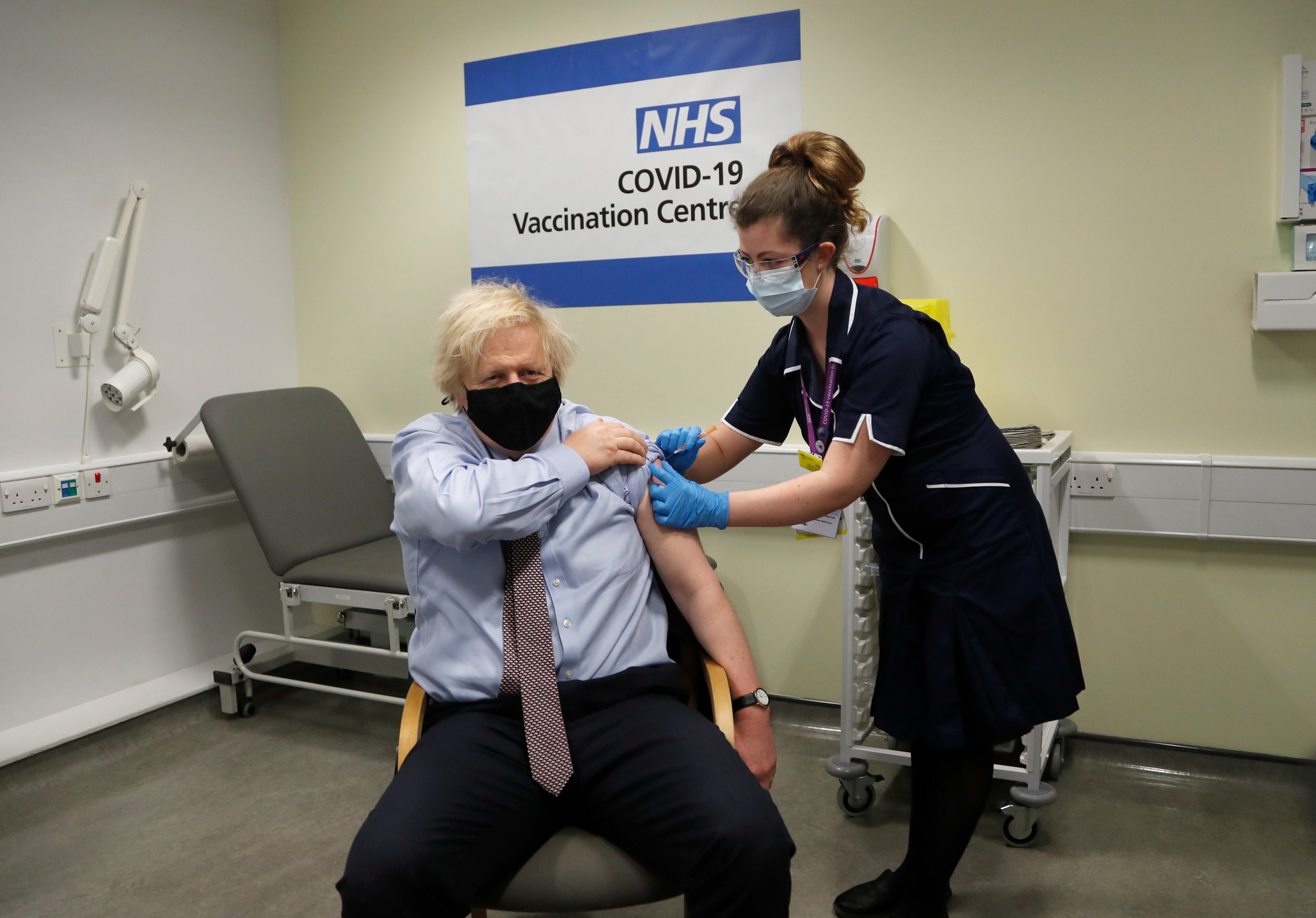 Nurse and clinical pod lead Lily Harrington adninisters the AstraZeneca vaccine to Mr Johnson at St Thomas’ Hospital, London, on Friday