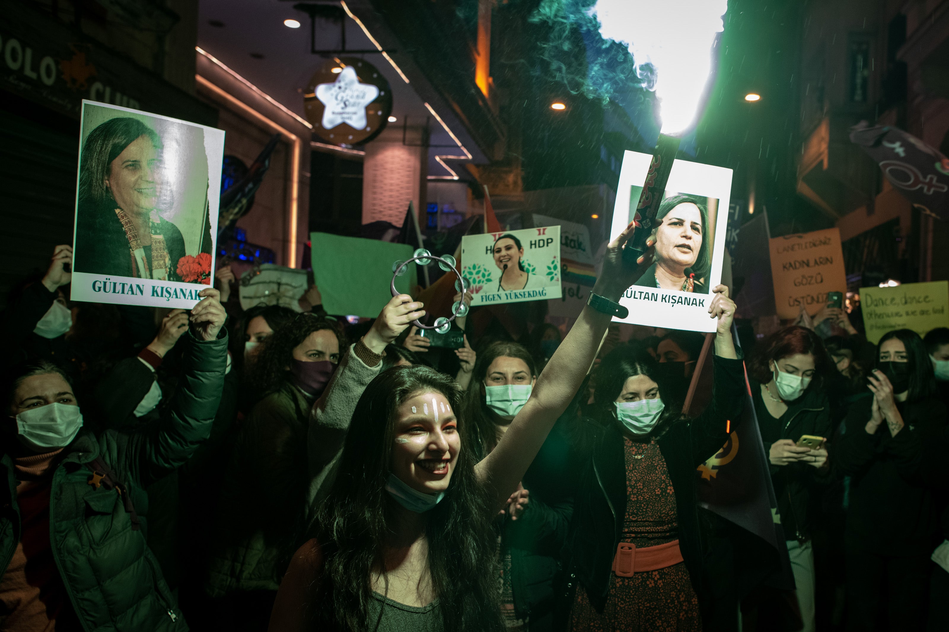 People chant slogans and sing songs during a rally for International Women’s Day on 8 March 2021 in Istanbul