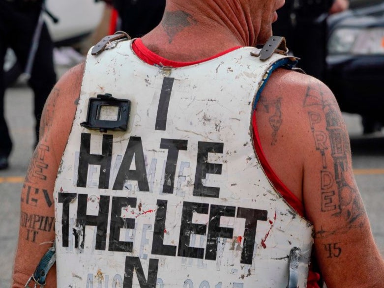 A Trump supporter wearing a “White Pride” tattoo and a hate message for The Left in August 2020. A new study claims that far right movements are seeking to co-opt environmentalism to push anti-immigration views