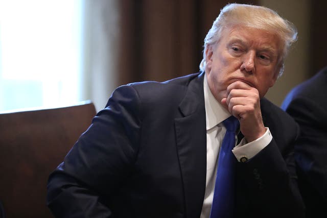 <p>U.S. President Donald Trump (R) presides over a meeting about immigration with Republican and Democrat members of Congress in the Cabinet Room at the White House January 9, 2018 in Washington, DC</p>