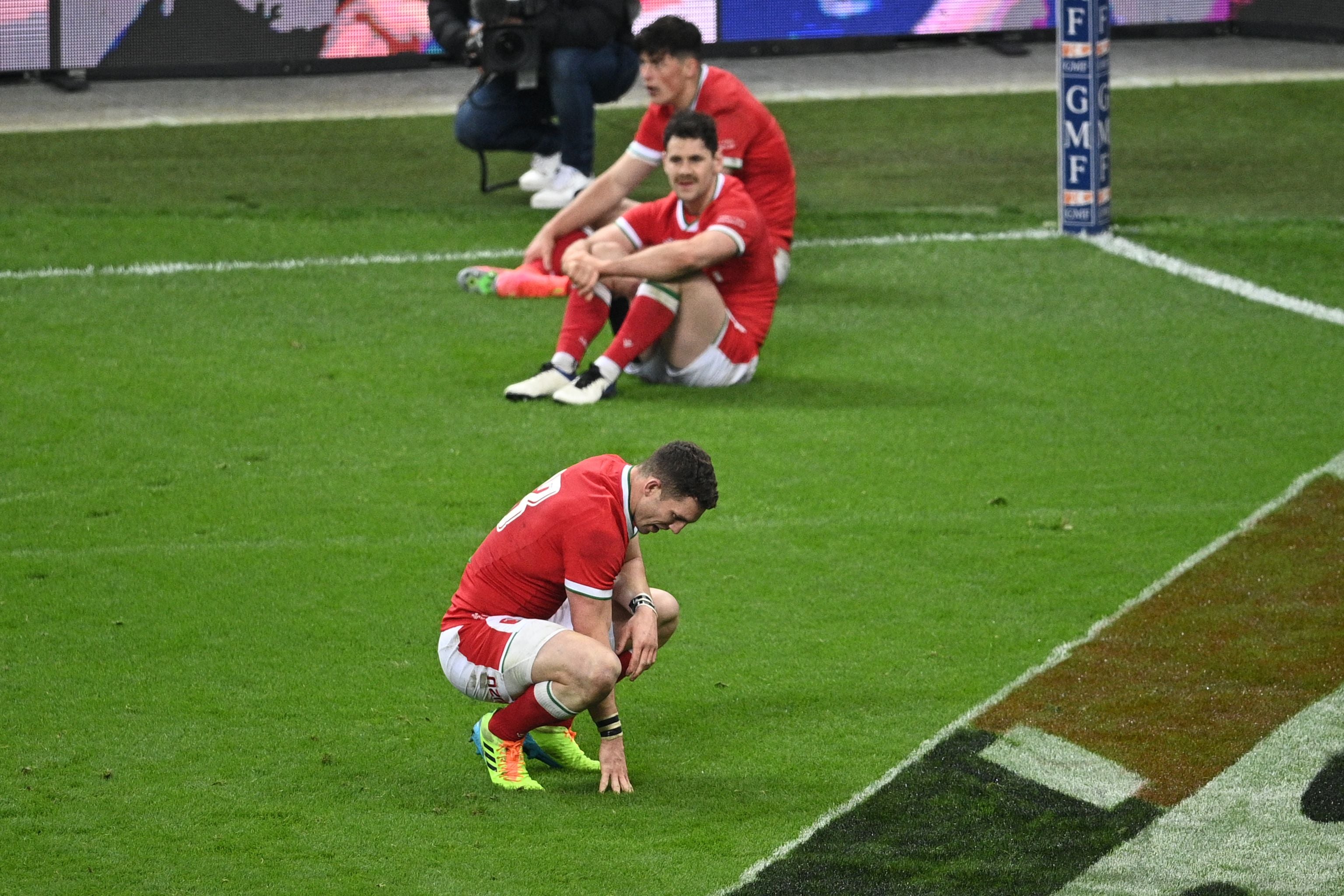 George North and teammates react after defeat in injury time to France