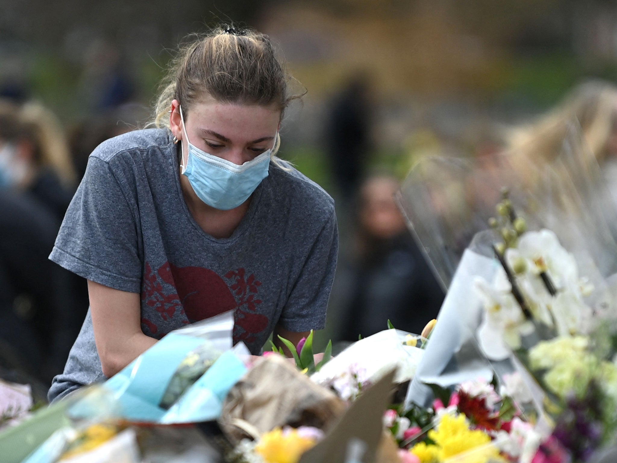 Women laid flowers to honour Sarah Everard, whose death prompted an outpouring of stories from women about harassment and assaults