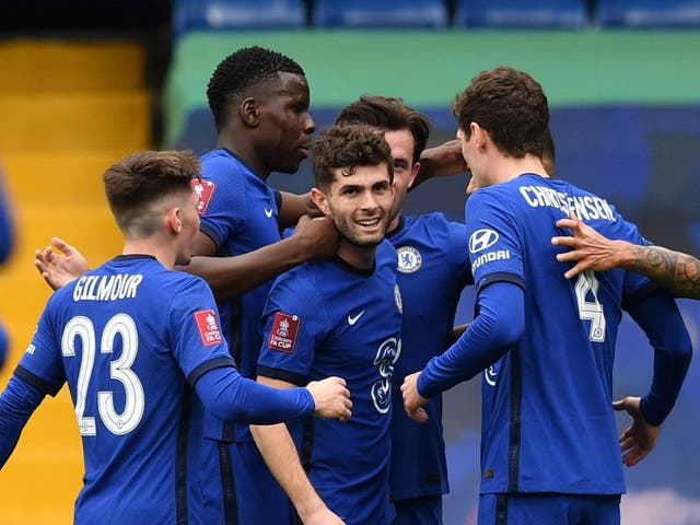 Chelsea players celebrate after Oliver Norwood’s own-goal