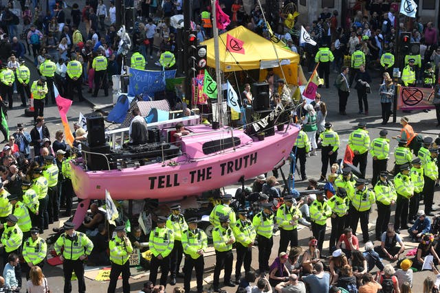<p>Police evict Extinction Rebellion activists after they blocked the junction around Oxford Circus in April 2019</p>