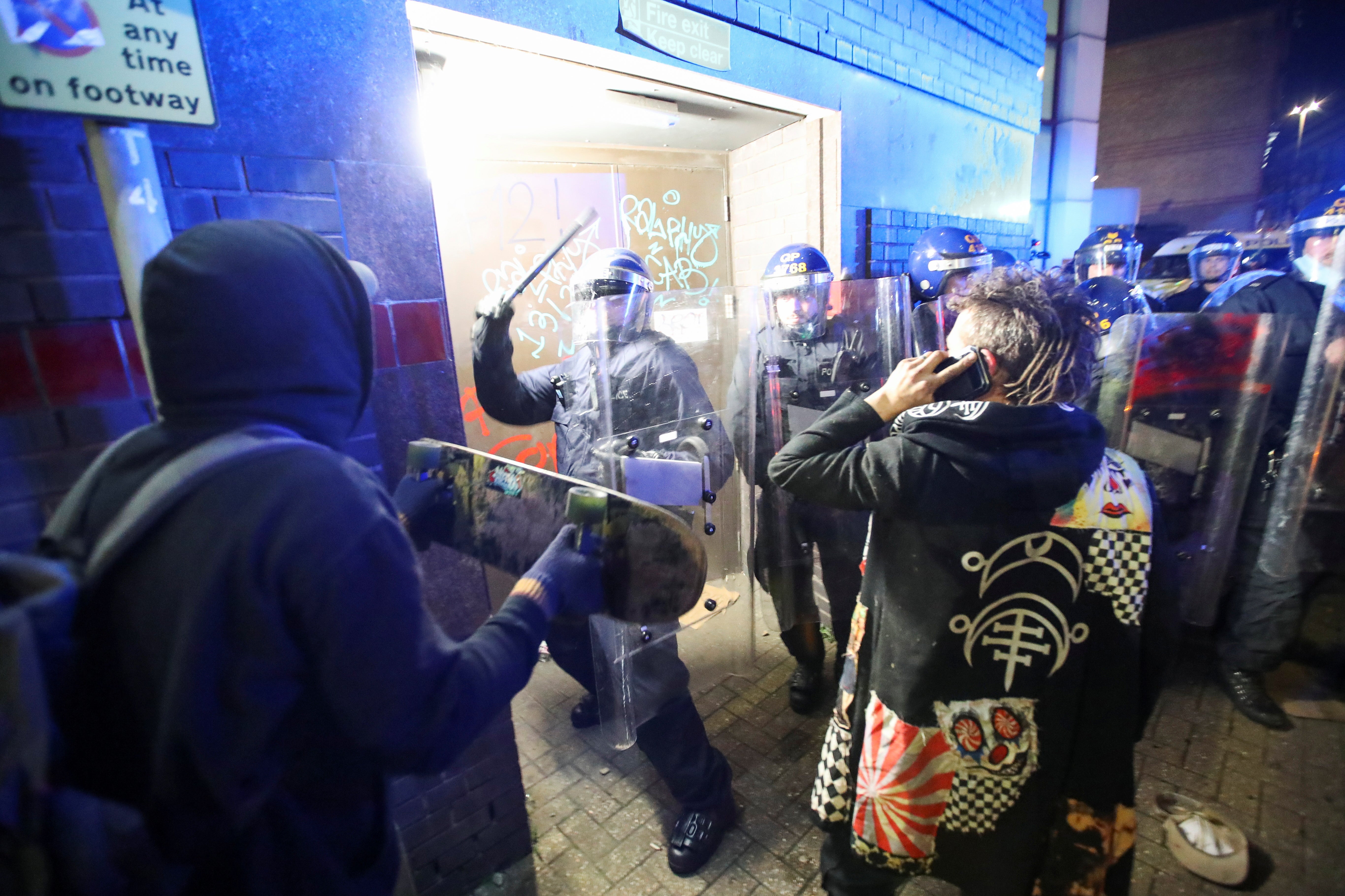 Demonstrators confront police officers during a protest against the new proposed policing bill, in Bristol on Sunday evening