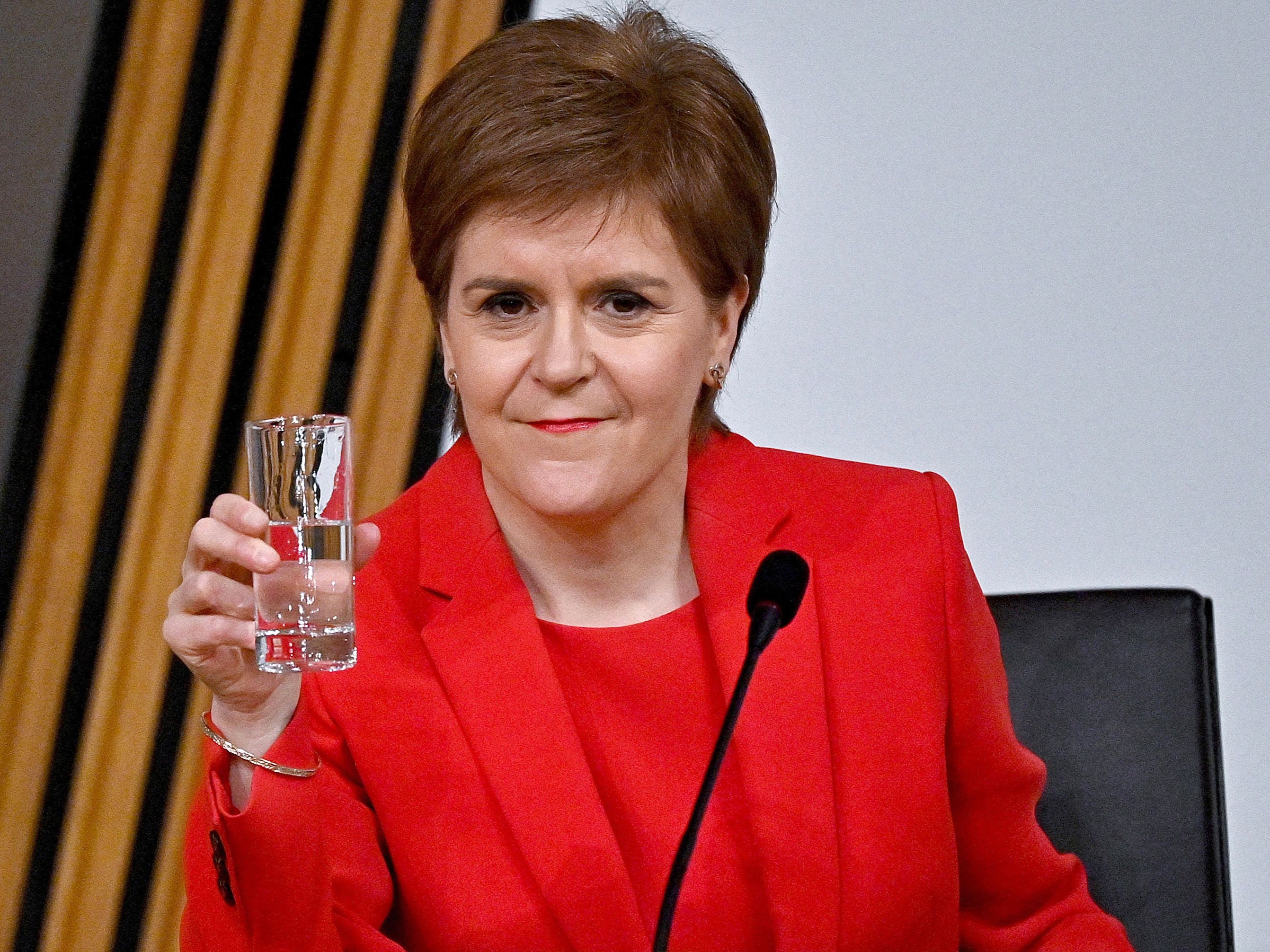 Nicola Sturgeon takes a drink as she gives evidence to a committee earlier this month