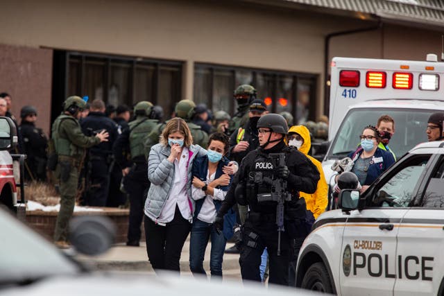 <p>Healthcare workers walk out of a King Sooper's Grocery store after a gunman opened fire on March 22, 2021 in Boulder, Colorado. </p>