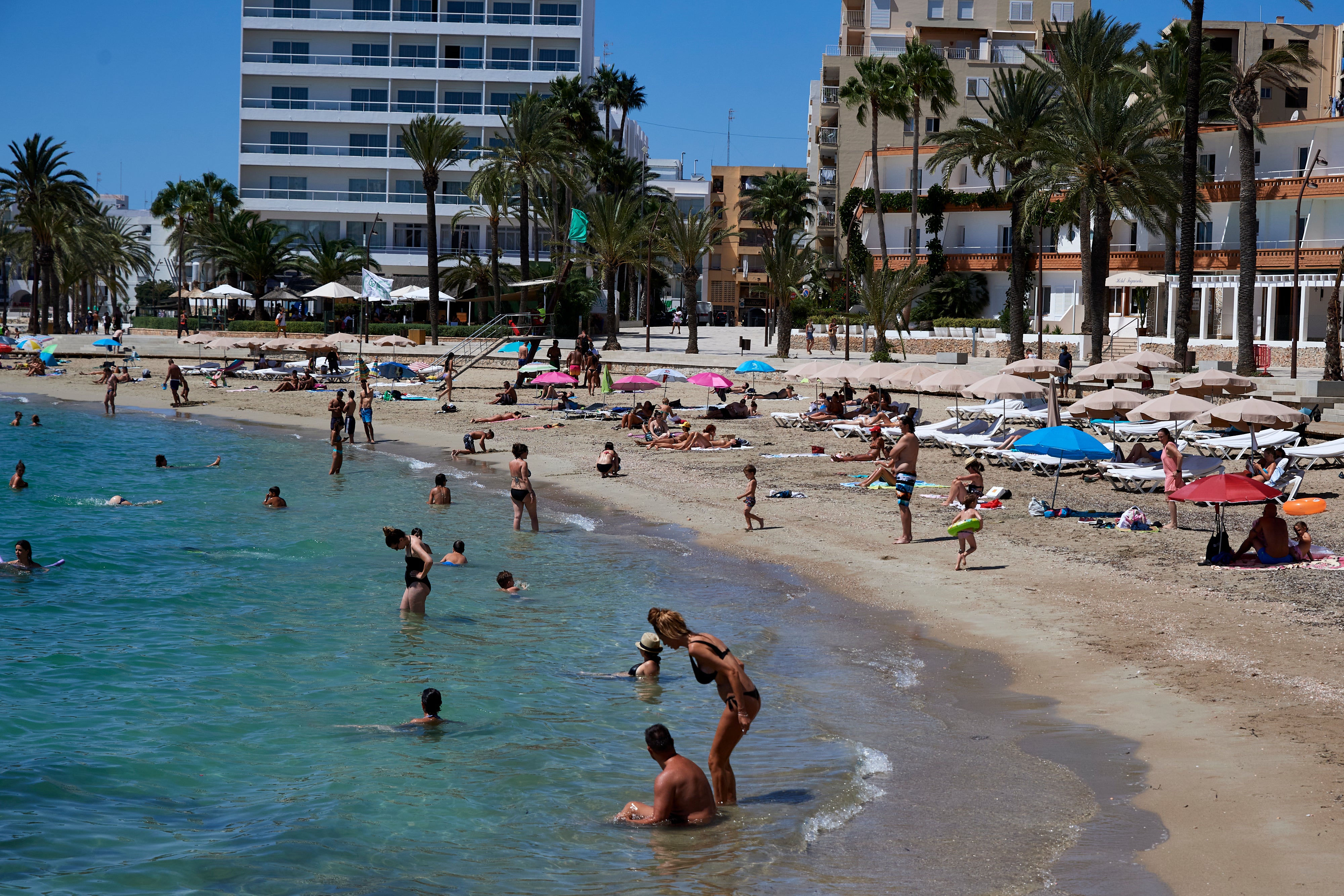 Figueretes beach in Ibiza, Spain, last summer. Foreign travel for most will not be permitted until 17 May at the earliest