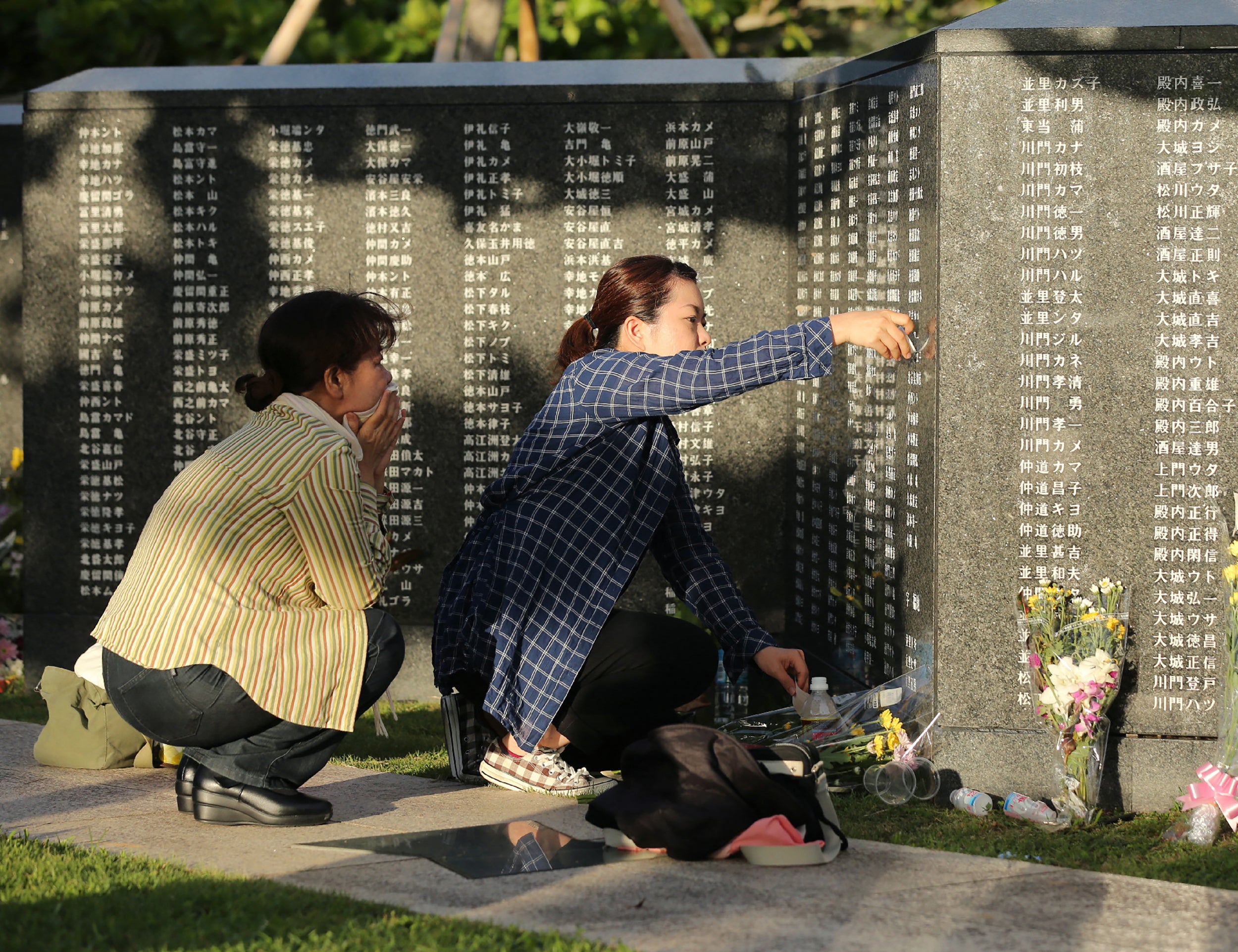 File image: Relatives of war victims pray at the Itoman Peace Memorial park in Itoman city, Okinawa prefecture on 23 June 2018