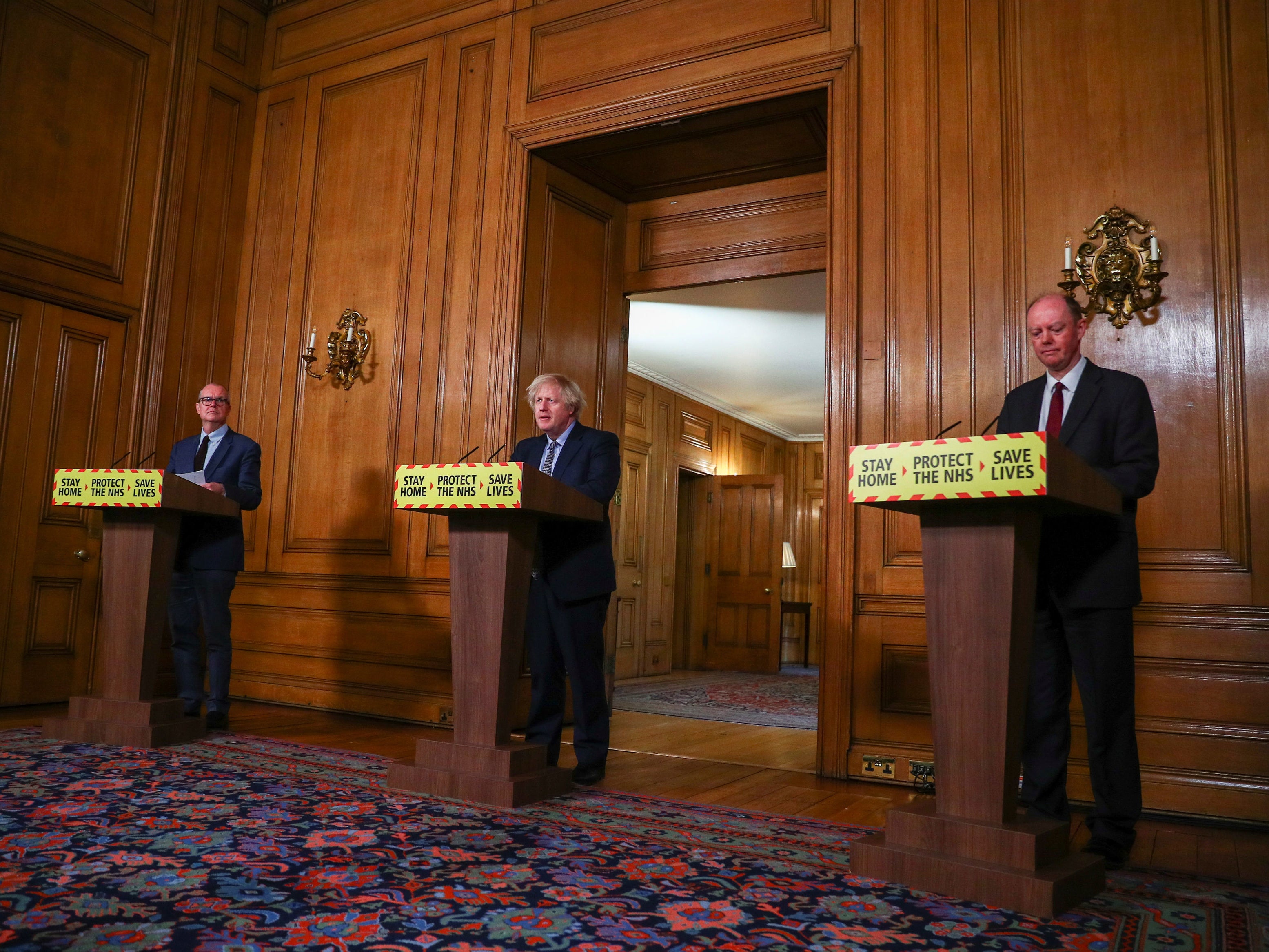 Boys’ club: Boris Johnson flanked by Patrick Vallance, left, and Chris Whitty