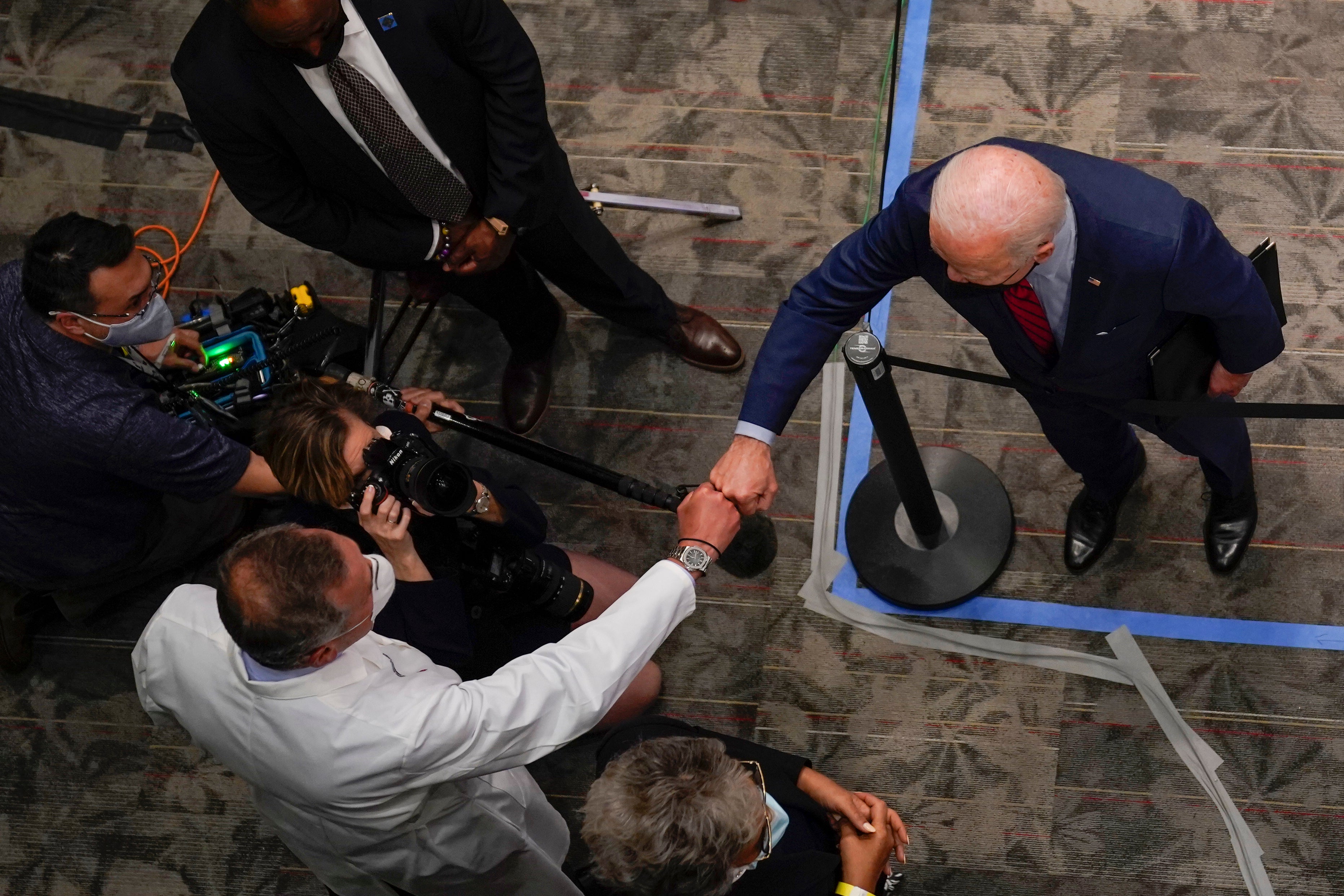 President Joe Biden fist bumps a doctor at the James Cancer Hospital and Solove Research Institute at The Ohio State University, last year