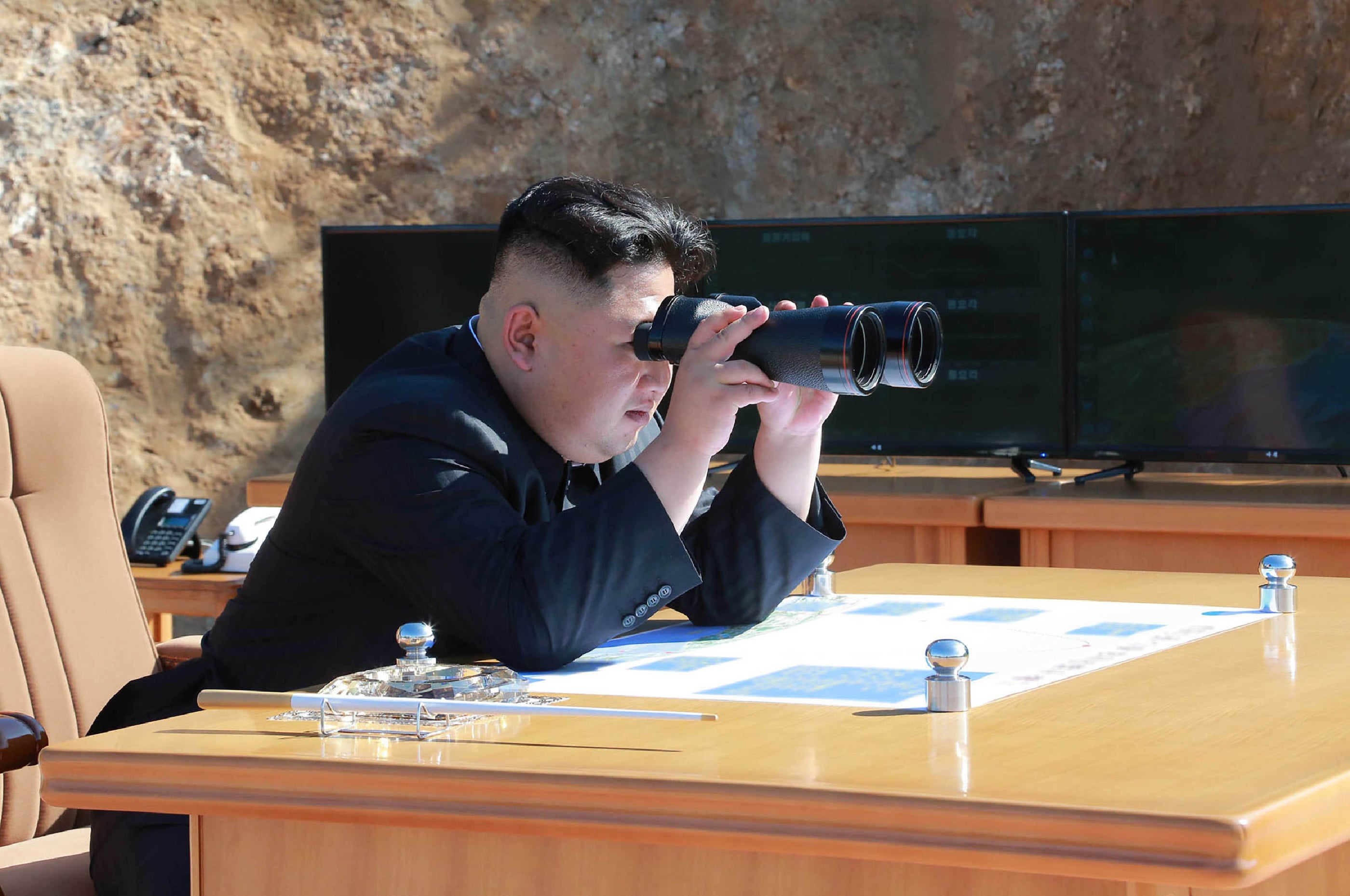 This picture taken and released on July 4, 2017 by North Korea's official Korean Central News Agency (KCNA) shows North Korean leader Kim Jong-Un inspecting the test-fire of intercontinental ballistic missile Hwasong-14 at an undisclosed location.