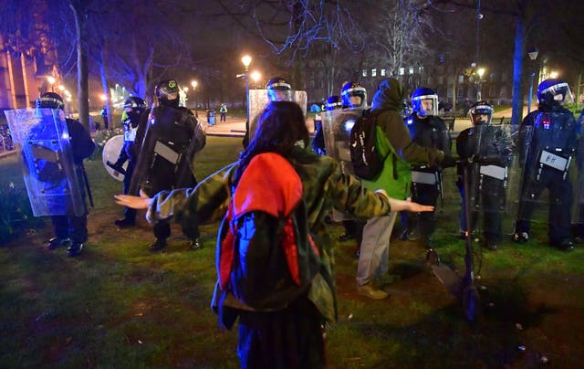 <p>Police and protesters at College Green in Bristol where police said around 130 people had gathered earlier in the evening</p>