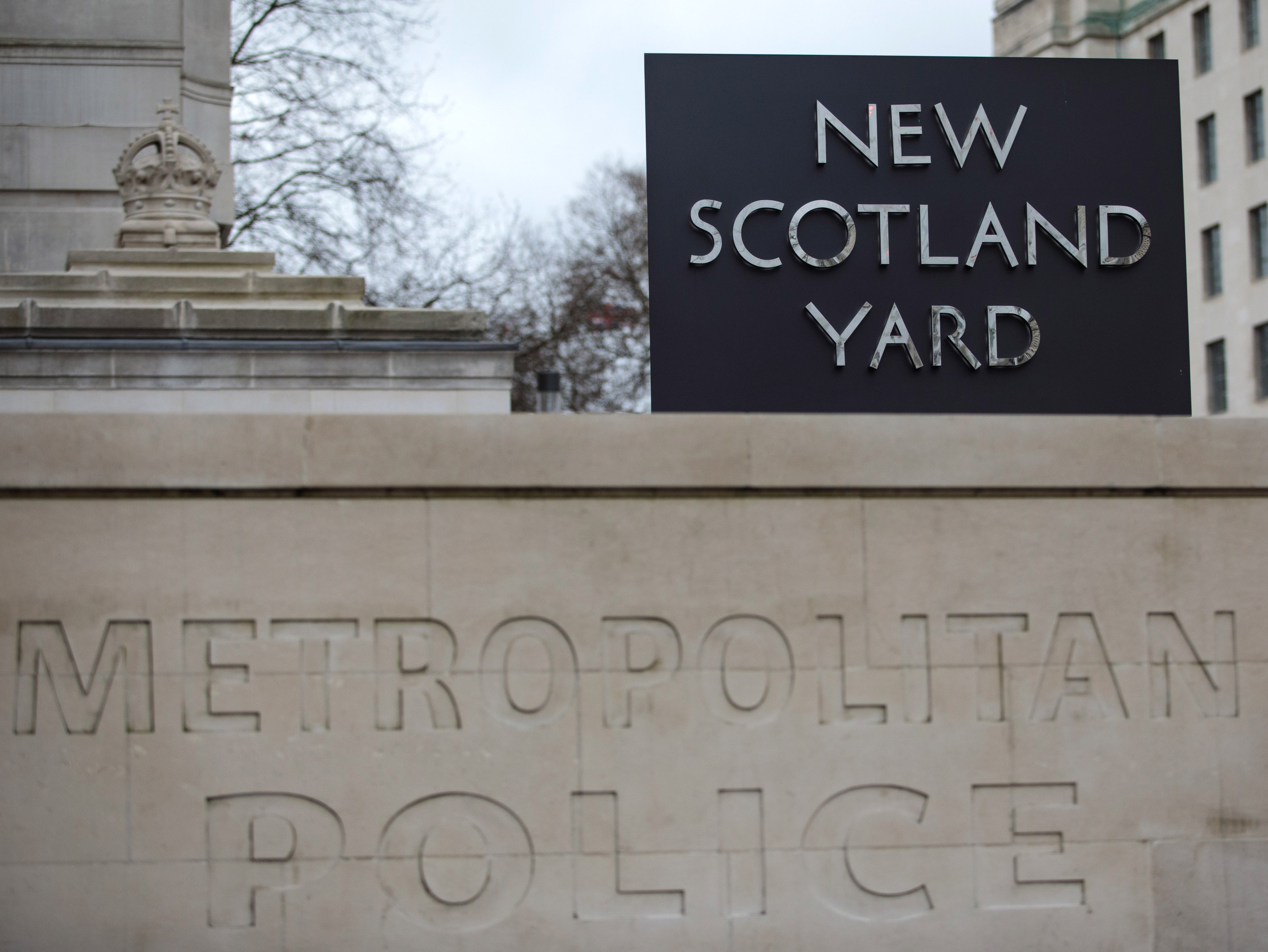 The New Scotland Yard logo outside the Metropolitan Police headquarters in London
