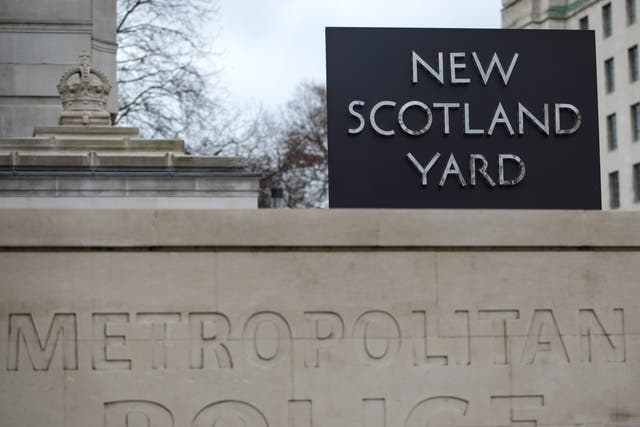 The New Scotland Yard logo outside the Metropolitan Police headquarters in London