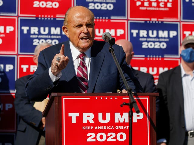 Former New York City Mayor Rudy Giuliani, personal attorney to US President Donald Trump, speaks after media announced that Democratic US presidential nominee Joe Biden has won the 2020 US presidential election