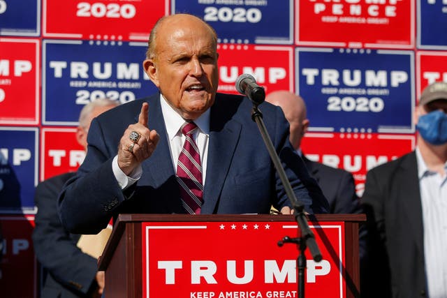Former New York City Mayor Rudy Giuliani, personal attorney to US President Donald Trump, speaks after media announced that Democratic US presidential nominee Joe Biden has won the 2020 US presidential election