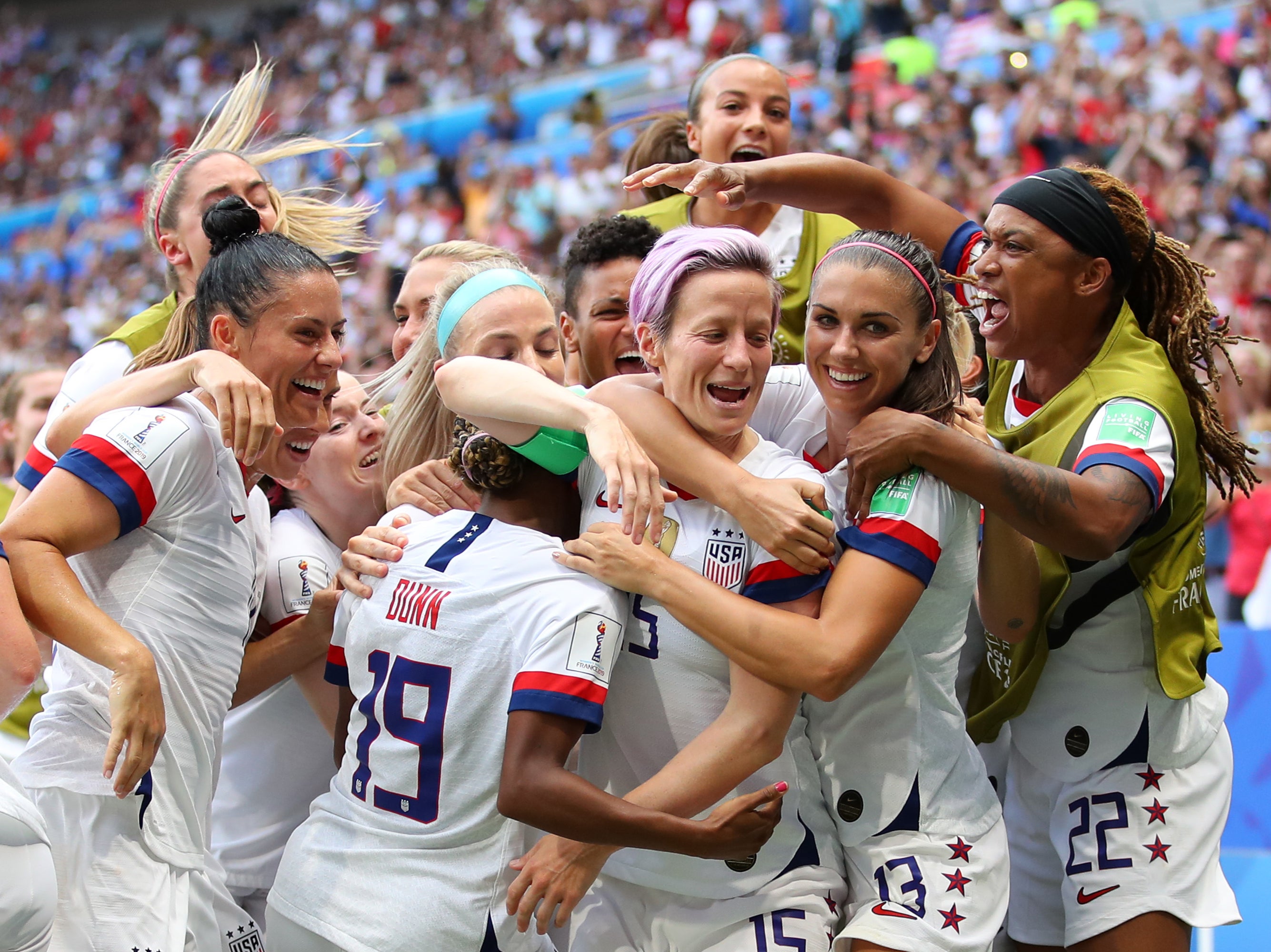 Megan Rapinoe of the USA celebrates with teammates