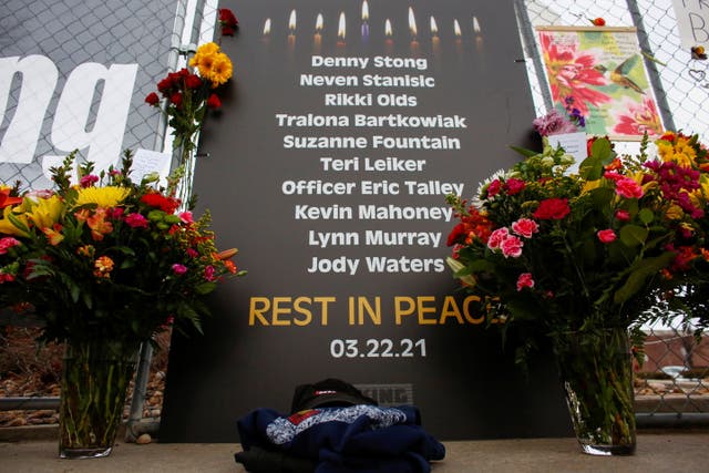 <p>A sign honoring the 10 victims is seen at the site of a mass shooting at a King Soopers grocery store in Boulder, Colorado, U.S. March 23, 2021.  </p>