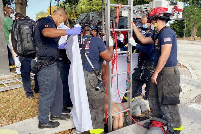 <p>Image from the scene as firefighters rescued Lyndsey Kennedy from the storm drain</p>