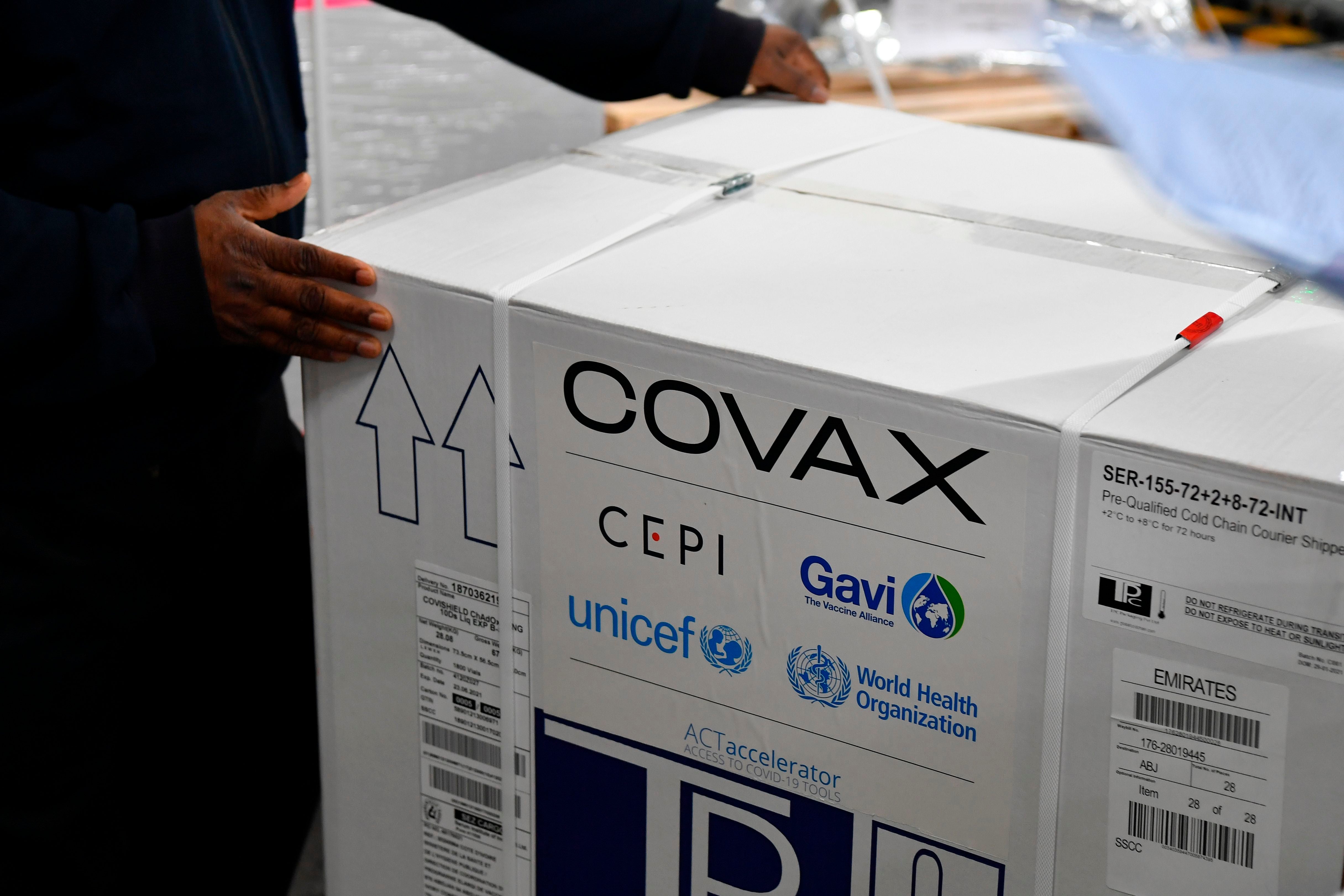 A carton box of a Covishield vaccine developed by Pune based Serum Institute of India (SII) is unloaded at the Mumbai airport on 24 February 2021, as part of the Covax scheme, which aims to procure and distribute inoculations fairly among all nations