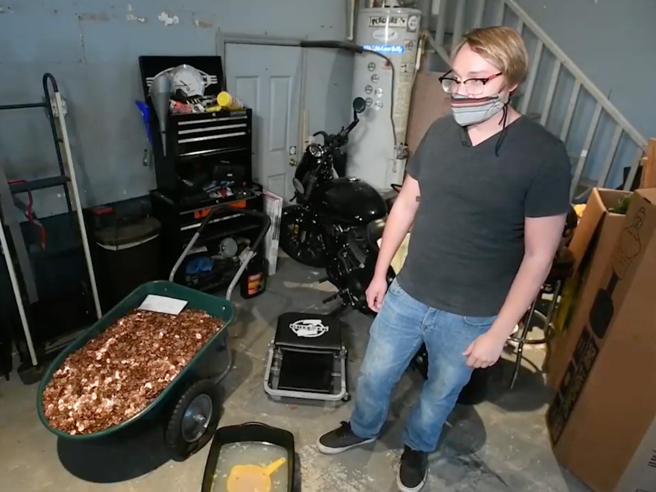 Andreas Flaten posing with the 91,515 pennies in his Georgia home