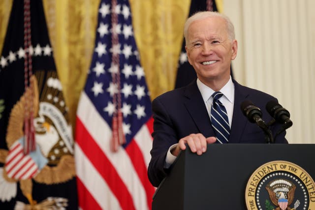 President Joe Biden smiles during the first news conference of his presidency in the East Room of the White House on 25 March, 2021