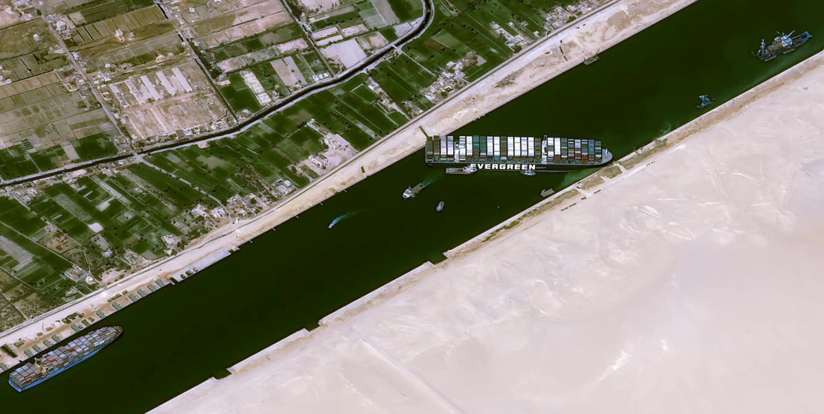 Egypt races to free giant vessel blocking Suez Canal