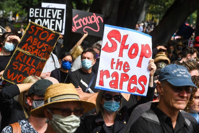 <p>People attend a protest against sexual violence and gender inequality in Melbourne on 15 March, 2021</p>