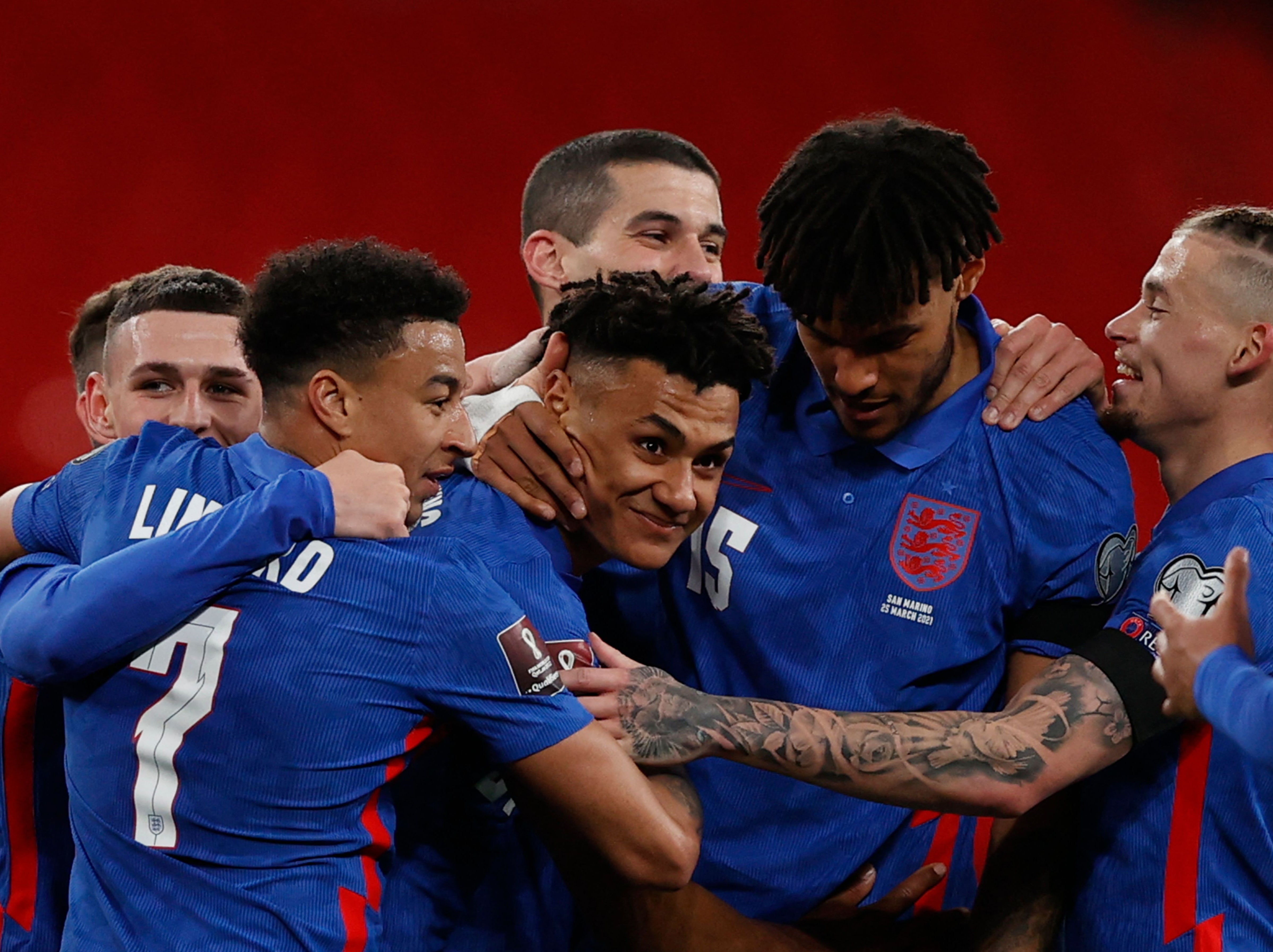 Ollie Watkins is congratulated by his England teammates