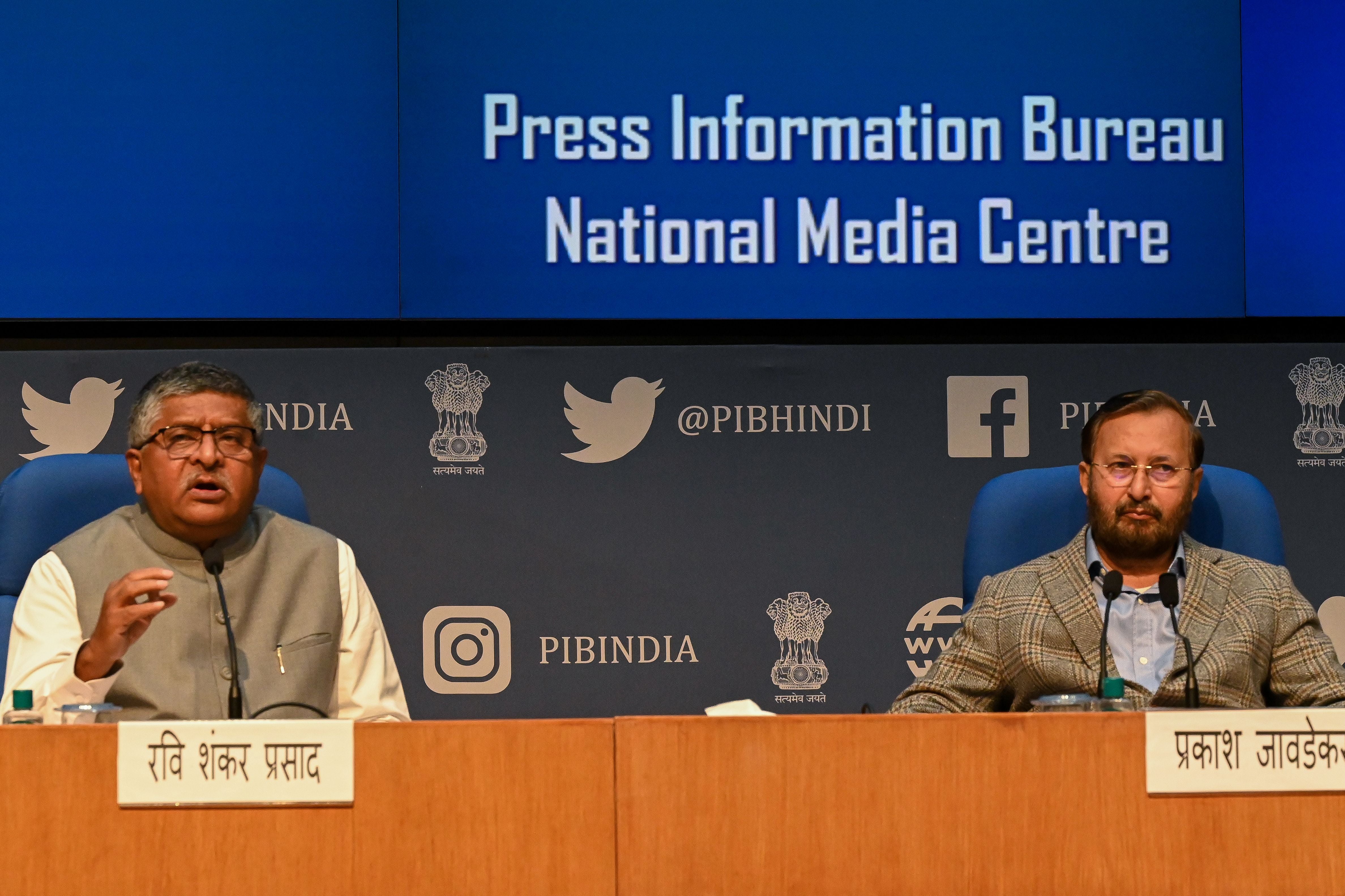 Indian IT minister Ravi Shankar Prasad (L) and the Minister of Information and Broadcasting Prakash Javadekar (R) while announcing the new rules for social media and OTT platforms in the country in February