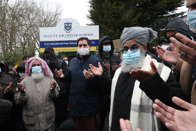<p>Protesters take part in a prayer outside Batley Grammar School in Batley, West Yorkshire</p>