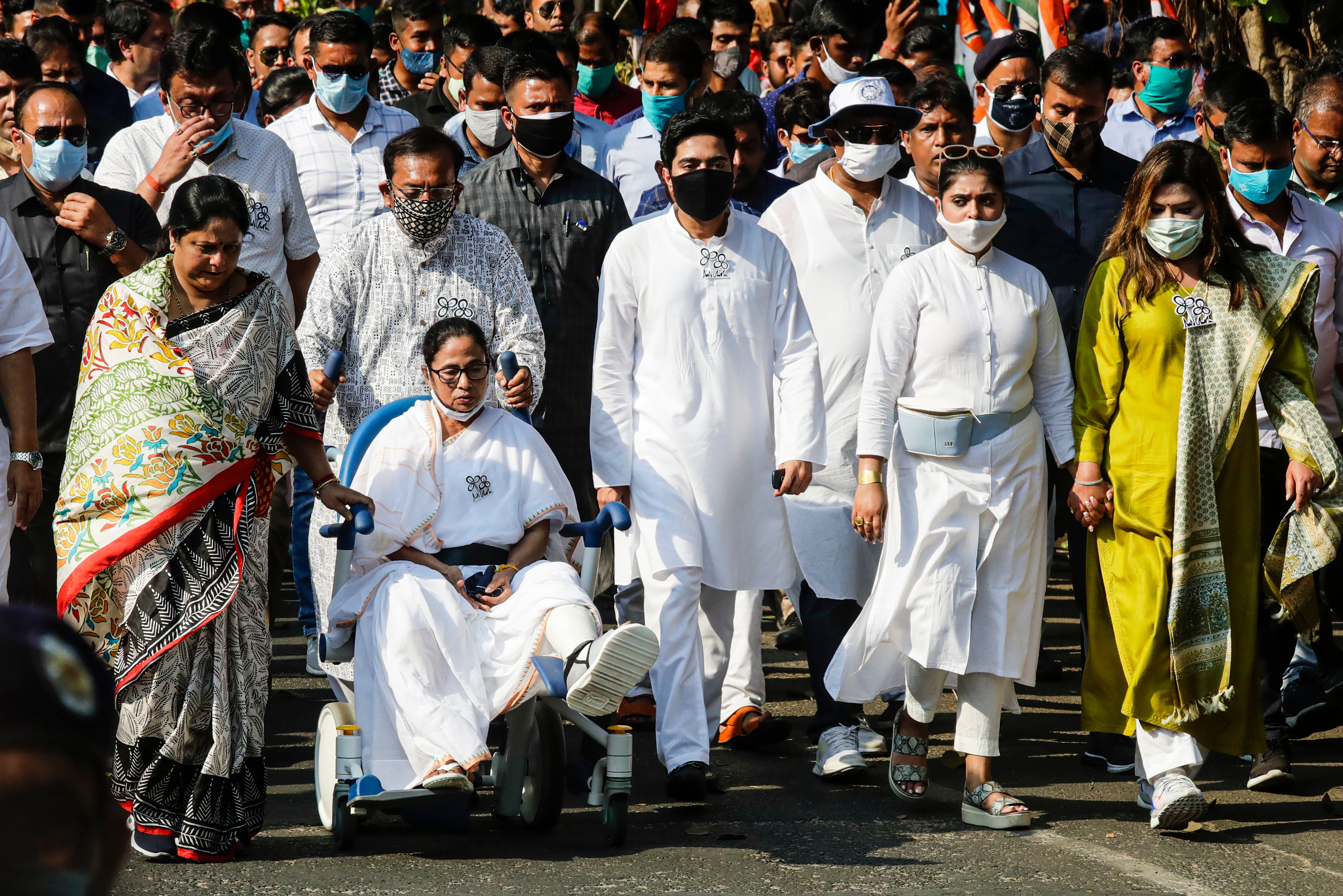 Chief minister of West Bengal Mamata Banerjee in a wheelchair along with other party leaders in a political rally in Kolkata a couple of days after an alleged attack on her