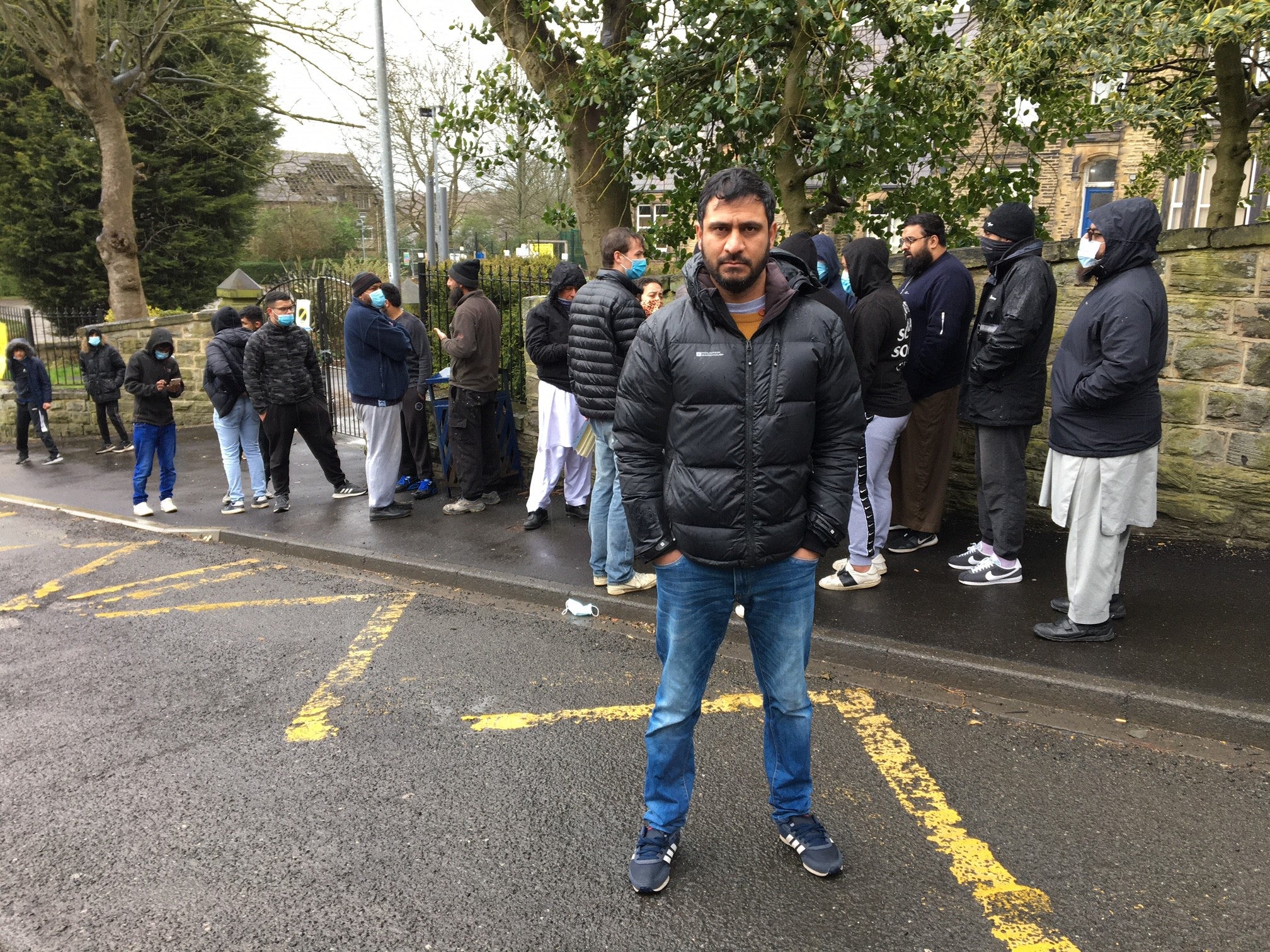 Binyamin Abbas stands in front of Batley Grammar School protests