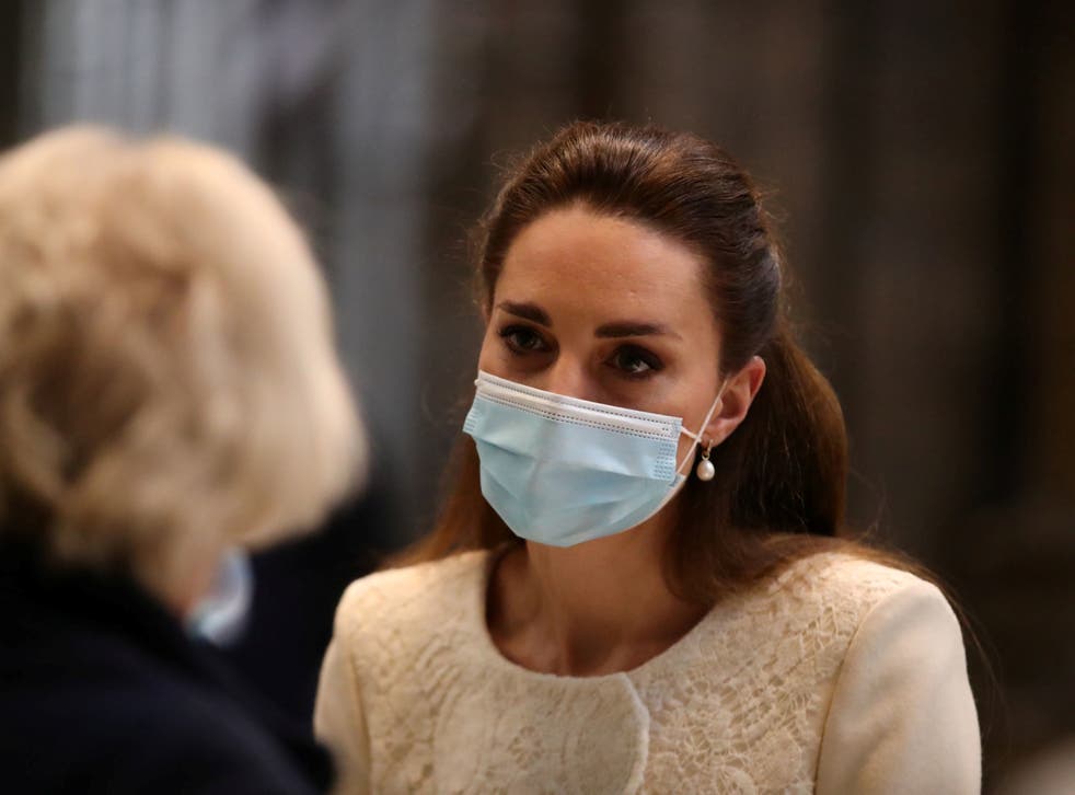 Catherine, Duchess of Cambridge, speaks to staff during a visit at a coronavirus disease (COVID-19) vaccination centre at Westminster Abbey